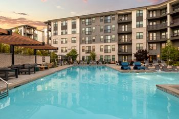 Resort-style saltwater swimming pool with tanning ledges and sundeck